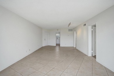 GROUND LEVEL CONDO WITH STUNNING LAKE & GOLF VIEWS Discover on Atlantis Golf Club in Florida - for sale on GolfHomes.com, golf home, golf lot