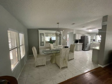 This lovely manufactured home is on leased land. Age 55+ and pet on Pine Lakes Country Club in Florida - for sale on GolfHomes.com, golf home, golf lot