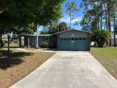 This lovely manufactured home is on leased land. Age 55+ and pet on Pine Lakes Country Club in Florida - for sale on GolfHomes.com, golf home, golf lot