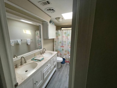 This lovely manufactured home is on leased land. Age 55+ and pet on Pine Lakes Country Club in Florida - for sale on GolfHomes.com, golf home, golf lot