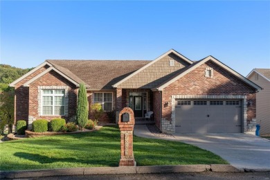 This 4-bedroom, 3-bathroom lake front Atrium Ranch home boasts on Raintree Country Club in Missouri - for sale on GolfHomes.com, golf home, golf lot