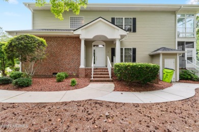 Sit on your enclosed porch and watch the golfers, gators, and on Sea Trail Golf Resort in North Carolina - for sale on GolfHomes.com, golf home, golf lot