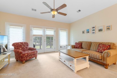 Sit on your enclosed porch and watch the golfers, gators, and on Sea Trail Golf Resort in North Carolina - for sale on GolfHomes.com, golf home, golf lot