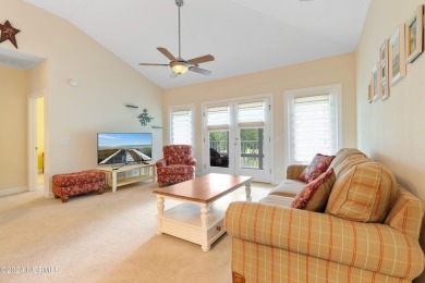 Sit on your enclosed porch and watch the golfers, gators, and on Sea Trail Golf Resort in North Carolina - for sale on GolfHomes.com, golf home, golf lot