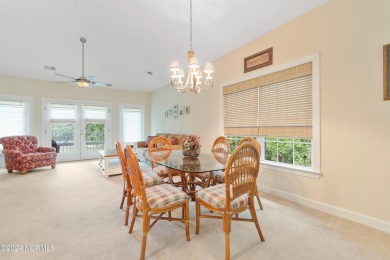 Sit on your enclosed porch and watch the golfers, gators, and on Sea Trail Golf Resort in North Carolina - for sale on GolfHomes.com, golf home, golf lot