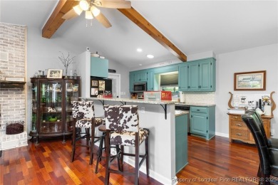 Incredible waterfront home located within the gated community of on Carolina Trace Country Club in North Carolina - for sale on GolfHomes.com, golf home, golf lot