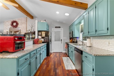 Incredible waterfront home located within the gated community of on Carolina Trace Country Club in North Carolina - for sale on GolfHomes.com, golf home, golf lot