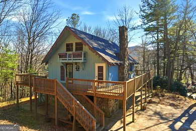 Welcome to this charming mountain chalet, ideally located in the on Sky Valley Resort and Country Club in Georgia - for sale on GolfHomes.com, golf home, golf lot