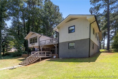 Incredible waterfront home located within the gated community of on Carolina Trace Country Club in North Carolina - for sale on GolfHomes.com, golf home, golf lot