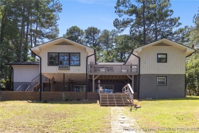 Incredible waterfront home located within the gated community of on Carolina Trace Country Club in North Carolina - for sale on GolfHomes.com, golf home, golf lot