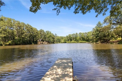 Incredible waterfront home located within the gated community of on Carolina Trace Country Club in North Carolina - for sale on GolfHomes.com, golf home, golf lot
