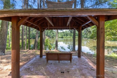 Incredible waterfront home located within the gated community of on Carolina Trace Country Club in North Carolina - for sale on GolfHomes.com, golf home, golf lot