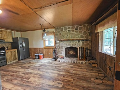This charming Northwoods-style 1 bed, 1 bath cabin is just on Northern Bay Golf Resort and Marina in Wisconsin - for sale on GolfHomes.com, golf home, golf lot