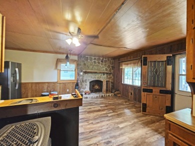 This charming Northwoods-style 1 bed, 1 bath cabin is just on Northern Bay Golf Resort and Marina in Wisconsin - for sale on GolfHomes.com, golf home, golf lot