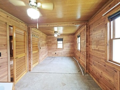 This charming Northwoods-style 1 bed, 1 bath cabin is just on Northern Bay Golf Resort and Marina in Wisconsin - for sale on GolfHomes.com, golf home, golf lot