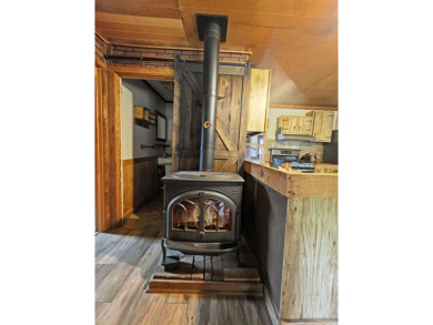 This charming Northwoods-style 1 bed, 1 bath cabin is just on Northern Bay Golf Resort and Marina in Wisconsin - for sale on GolfHomes.com, golf home, golf lot