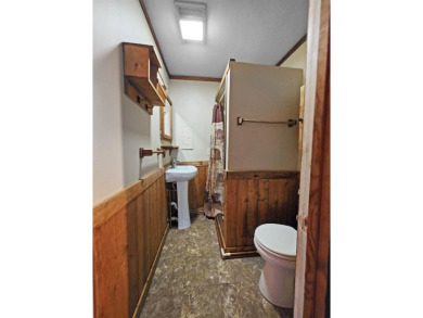 This charming Northwoods-style 1 bed, 1 bath cabin is just on Northern Bay Golf Resort and Marina in Wisconsin - for sale on GolfHomes.com, golf home, golf lot