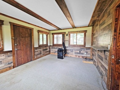 This charming Northwoods-style 1 bed, 1 bath cabin is just on Northern Bay Golf Resort and Marina in Wisconsin - for sale on GolfHomes.com, golf home, golf lot