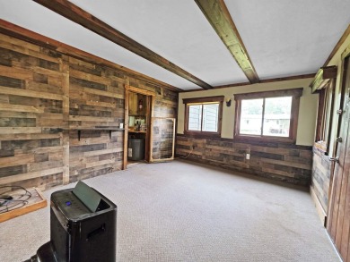 This charming Northwoods-style 1 bed, 1 bath cabin is just on Northern Bay Golf Resort and Marina in Wisconsin - for sale on GolfHomes.com, golf home, golf lot