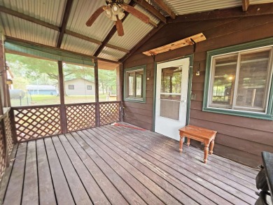 This charming Northwoods-style 1 bed, 1 bath cabin is just on Northern Bay Golf Resort and Marina in Wisconsin - for sale on GolfHomes.com, golf home, golf lot