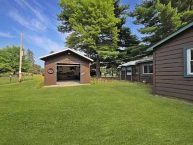 This charming Northwoods-style 1 bed, 1 bath cabin is just on Northern Bay Golf Resort and Marina in Wisconsin - for sale on GolfHomes.com, golf home, golf lot