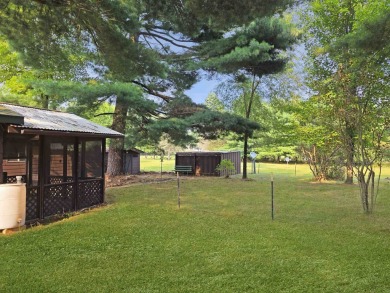 This charming Northwoods-style 1 bed, 1 bath cabin is just on Northern Bay Golf Resort and Marina in Wisconsin - for sale on GolfHomes.com, golf home, golf lot