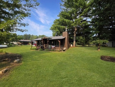 This charming Northwoods-style 1 bed, 1 bath cabin is just on Northern Bay Golf Resort and Marina in Wisconsin - for sale on GolfHomes.com, golf home, golf lot
