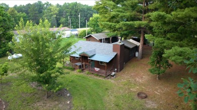 This charming Northwoods-style 1 bed, 1 bath cabin is just on Northern Bay Golf Resort and Marina in Wisconsin - for sale on GolfHomes.com, golf home, golf lot