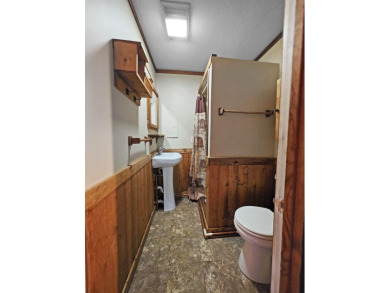 This charming Northwoods-style 1 bed, 1 bath cabin is just on Northern Bay Golf Resort and Marina in Wisconsin - for sale on GolfHomes.com, golf home, golf lot