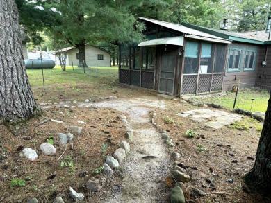 This charming Northwoods-style 1 bed, 1 bath cabin is just on Northern Bay Golf Resort and Marina in Wisconsin - for sale on GolfHomes.com, golf home, golf lot