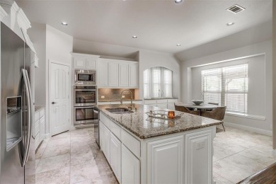 Gorgeous home with a stone & brick exterior and beautiful curb on Mansfield National Golf Club in Texas - for sale on GolfHomes.com, golf home, golf lot