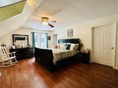 This spacious 4 (possibly 5) bedroom, 2 bathroom home is nestled on Selmer Country Club in Tennessee - for sale on GolfHomes.com, golf home, golf lot