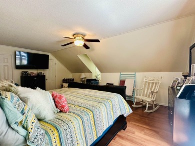 This spacious 4 (possibly 5) bedroom, 2 bathroom home is nestled on Selmer Country Club in Tennessee - for sale on GolfHomes.com, golf home, golf lot