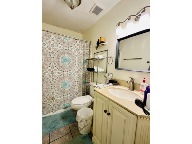 This spacious 4 (possibly 5) bedroom, 2 bathroom home is nestled on Selmer Country Club in Tennessee - for sale on GolfHomes.com, golf home, golf lot