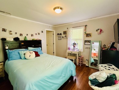This spacious 4 (possibly 5) bedroom, 2 bathroom home is nestled on Selmer Country Club in Tennessee - for sale on GolfHomes.com, golf home, golf lot