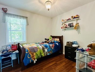 This spacious 4 (possibly 5) bedroom, 2 bathroom home is nestled on Selmer Country Club in Tennessee - for sale on GolfHomes.com, golf home, golf lot