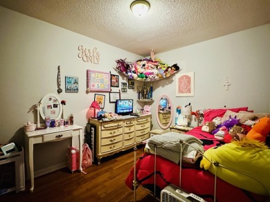 This spacious 4 (possibly 5) bedroom, 2 bathroom home is nestled on Selmer Country Club in Tennessee - for sale on GolfHomes.com, golf home, golf lot