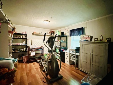This spacious 4 (possibly 5) bedroom, 2 bathroom home is nestled on Selmer Country Club in Tennessee - for sale on GolfHomes.com, golf home, golf lot