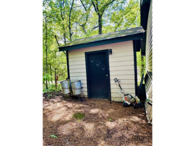 This spacious 4 (possibly 5) bedroom, 2 bathroom home is nestled on Selmer Country Club in Tennessee - for sale on GolfHomes.com, golf home, golf lot