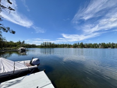 LAKEFRONT HOME - Fabulous 3 bedroom 2 bath home with amazing on Garland Resort and Golf Club  in Michigan - for sale on GolfHomes.com, golf home, golf lot