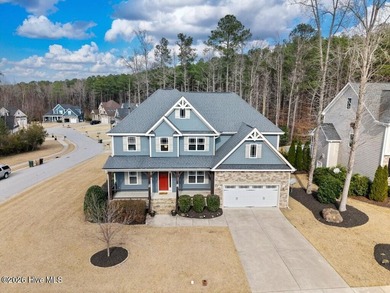 Situated on a corner lot, this home welcomes you with a concrete on The Neuse Golf Club in North Carolina - for sale on GolfHomes.com, golf home, golf lot