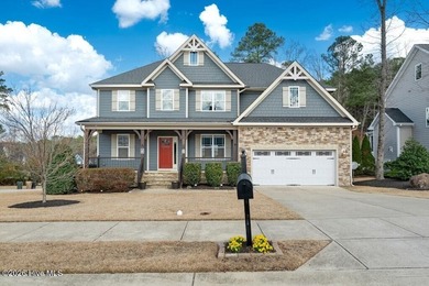 Situated on a corner lot, this home welcomes you with a concrete on The Neuse Golf Club in North Carolina - for sale on GolfHomes.com, golf home, golf lot