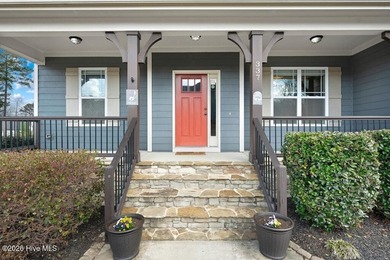 Situated on a corner lot, this home welcomes you with a concrete on The Neuse Golf Club in North Carolina - for sale on GolfHomes.com, golf home, golf lot