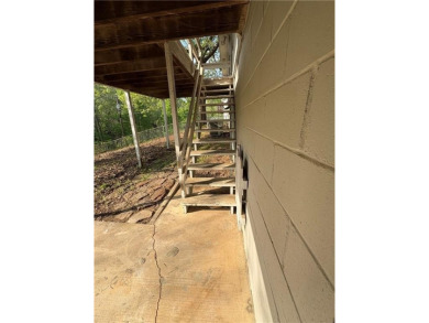 Nice two level brick home in a gorgeous area close to the lake on Prairie Creek Country Club in Arkansas - for sale on GolfHomes.com, golf home, golf lot
