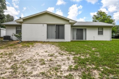 Spacious 4 BEDROOM home with 2 car garage on an OVERSIZED on Citrus Springs Country Club in Florida - for sale on GolfHomes.com, golf home, golf lot