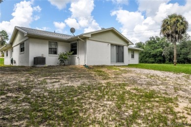 Spacious 4 BEDROOM home with 2 car garage on an OVERSIZED on Citrus Springs Country Club in Florida - for sale on GolfHomes.com, golf home, golf lot