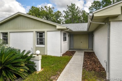 Spacious 4 BEDROOM home with 2 car garage on an OVERSIZED on Citrus Springs Country Club in Florida - for sale on GolfHomes.com, golf home, golf lot