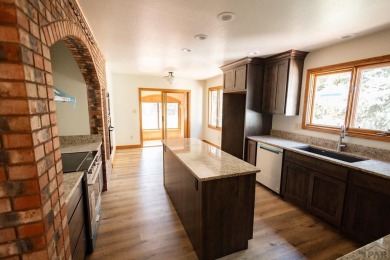 Discover this exquisite 5-bedroom, 3-bathroom home, freshly on Desert Hawk At Pueblo West in Colorado - for sale on GolfHomes.com, golf home, golf lot