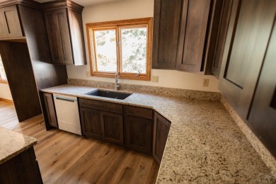 Discover this exquisite 5-bedroom, 3-bathroom home, freshly on Desert Hawk At Pueblo West in Colorado - for sale on GolfHomes.com, golf home, golf lot