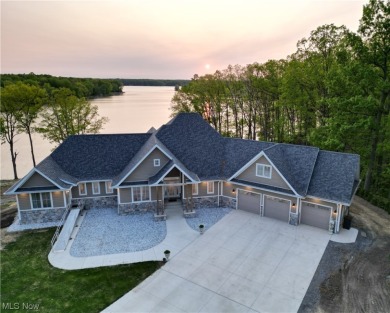 Escape to the tranquil embrace of your private lakefront on Lakeside Golf Course in Ohio - for sale on GolfHomes.com, golf home, golf lot